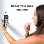 Woman applying lipstick while holding a mirror case, with text 'Check Your Look Anytime'.
