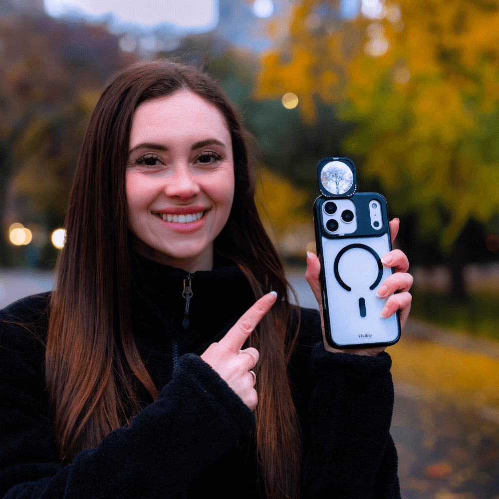 Smiling girl holding a mirror phone case