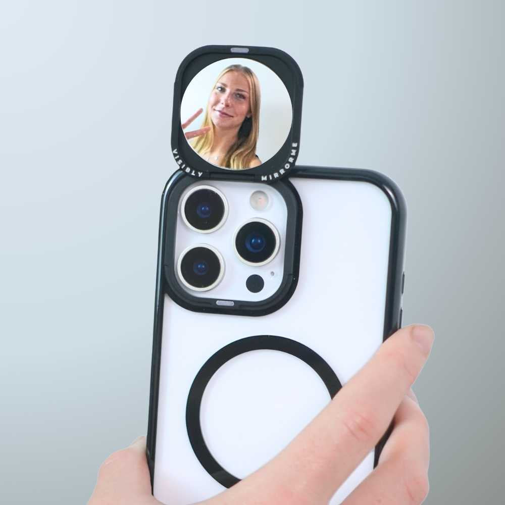 Close-up mirror phone case showing a reflection of a smiling woman
